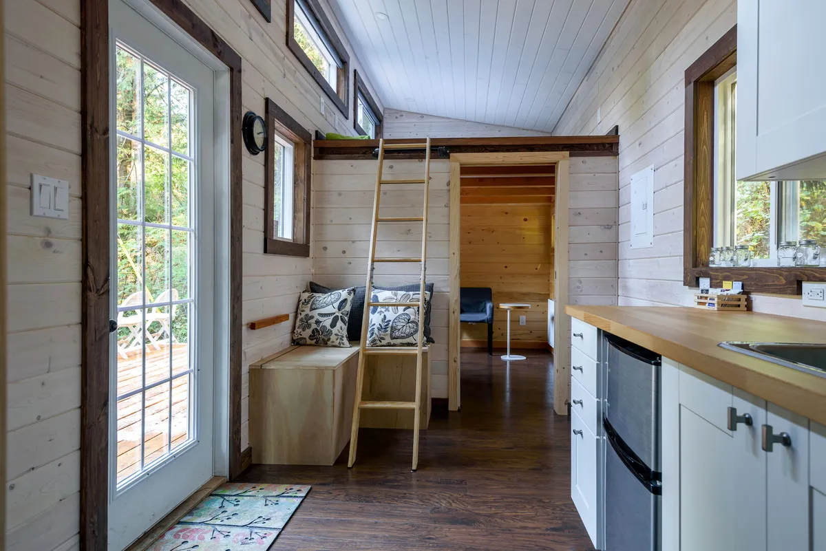dining room and kitchen in a tiny rustic log cabin