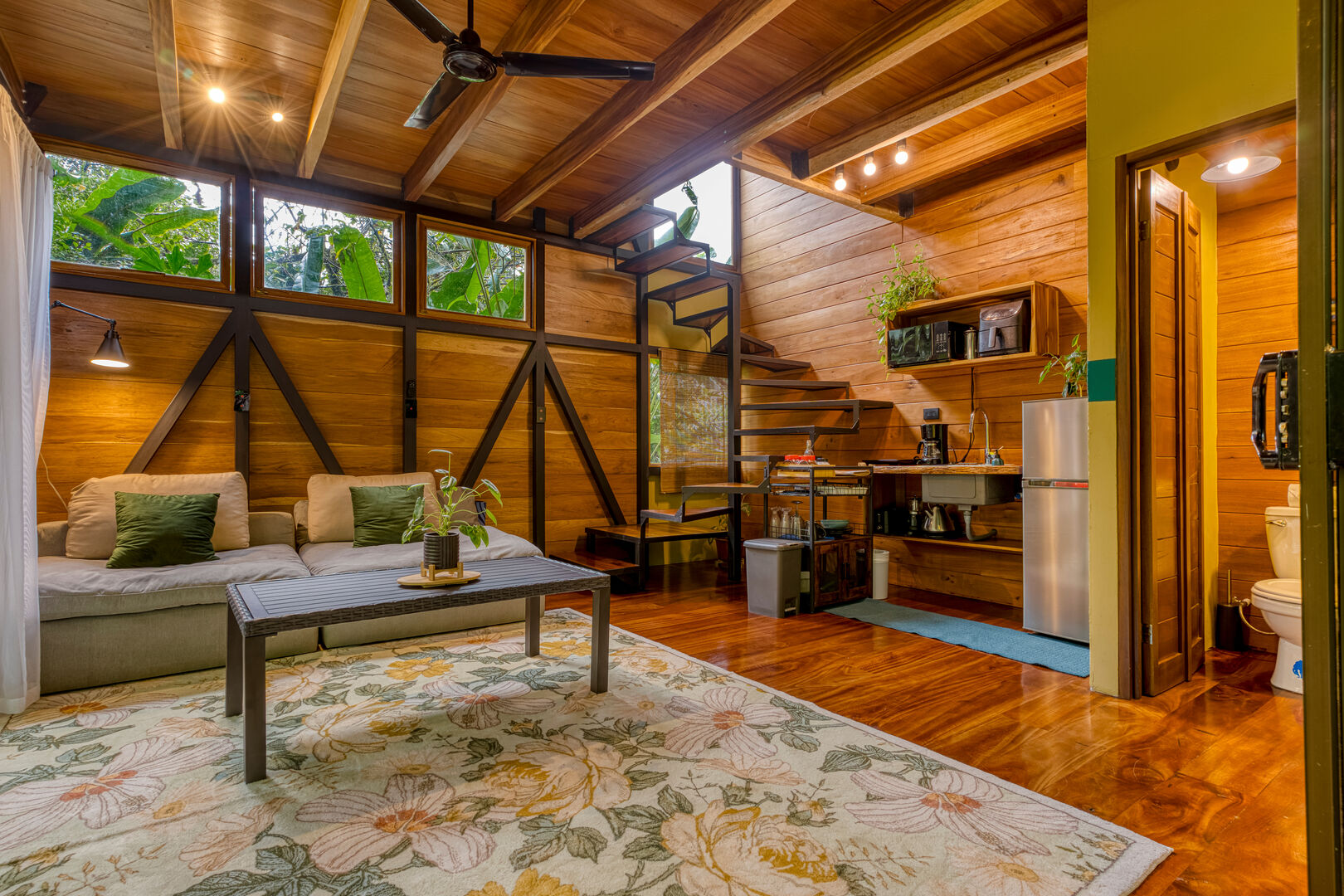 Wooden tiny house interior with living room kitchen