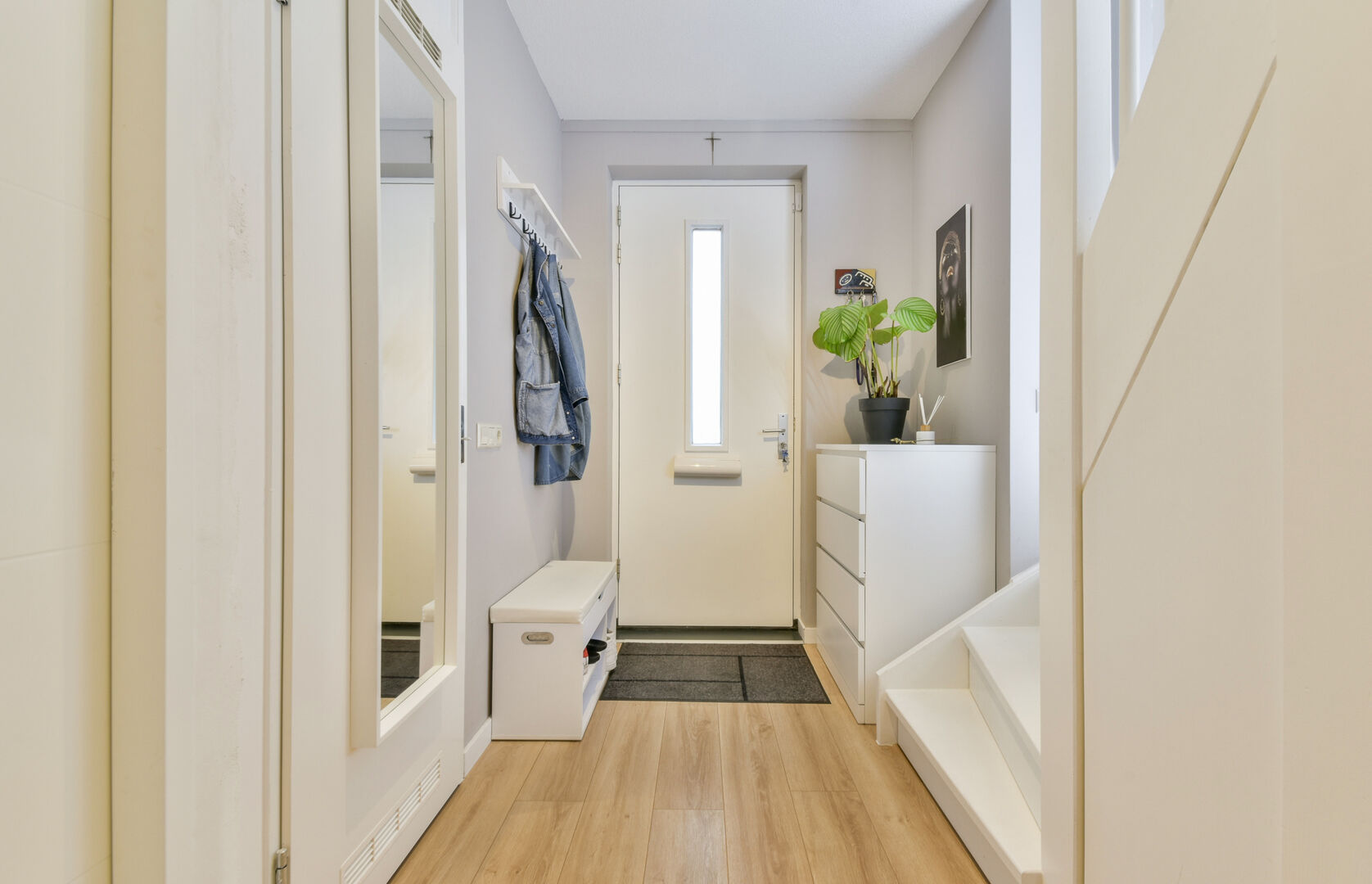 Hallway interior with white walls and wooden floors