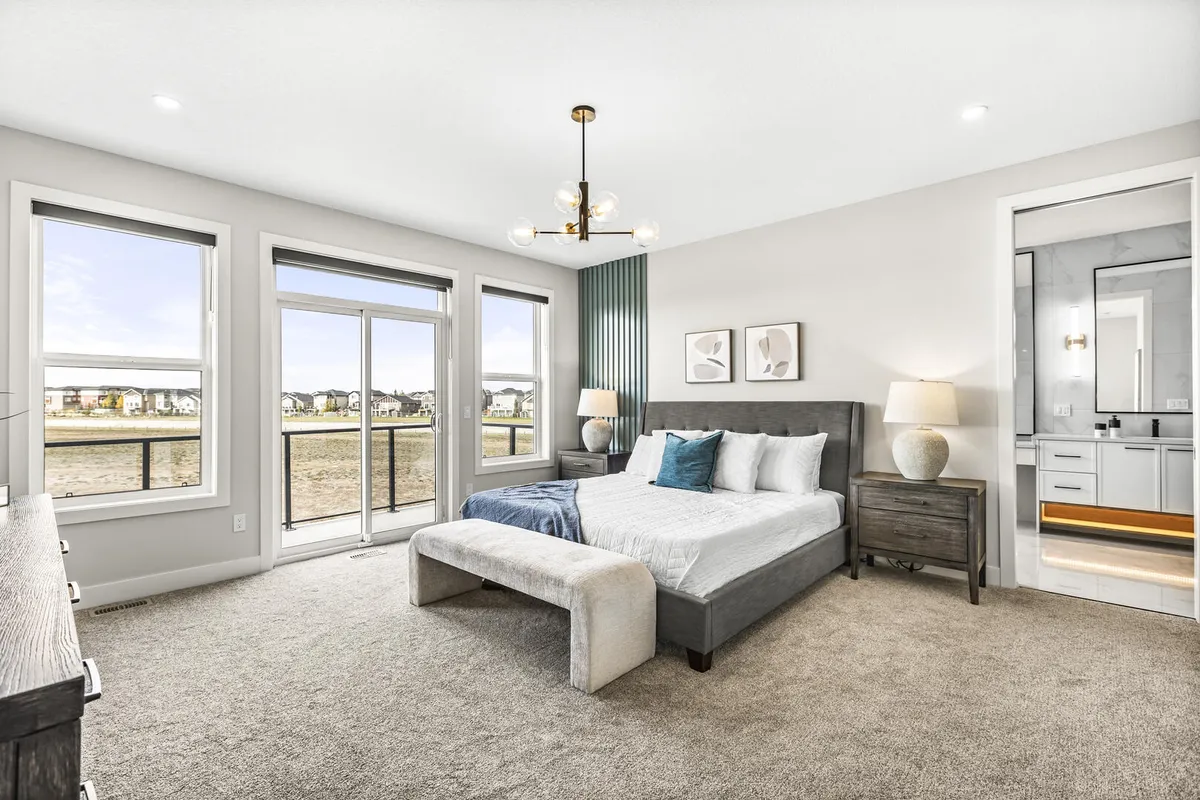 Light and bright modern master bedroom with teal accents