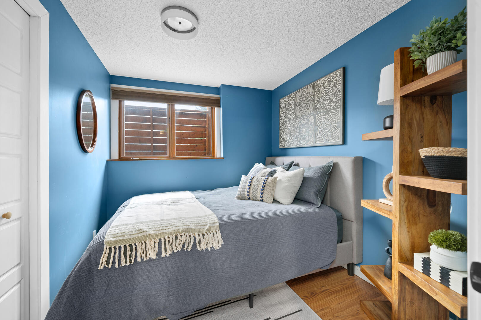 Cozy modern bedroom with large wooden shelves