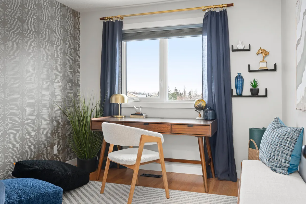 Clean modern home office with blue drapes