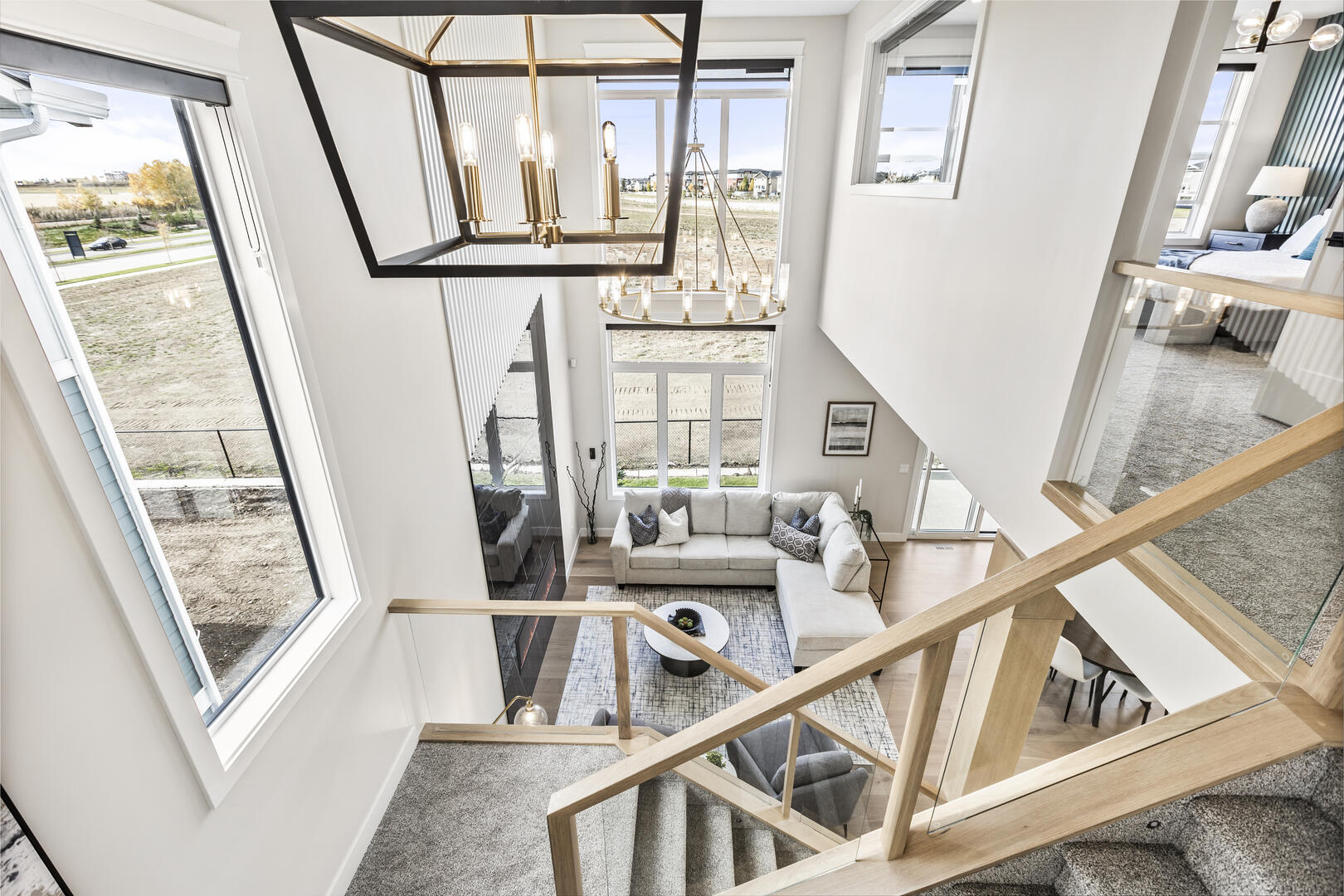 Two story modern open concept staircase, white oak and glass staircase railing
