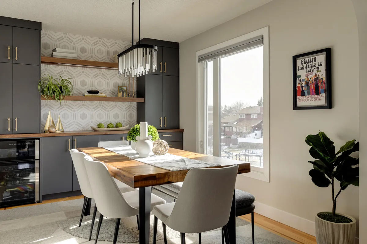 Light and bright dining room with blue grey built-ins and gold hardware, wood dining table with upholstered chairs and bench