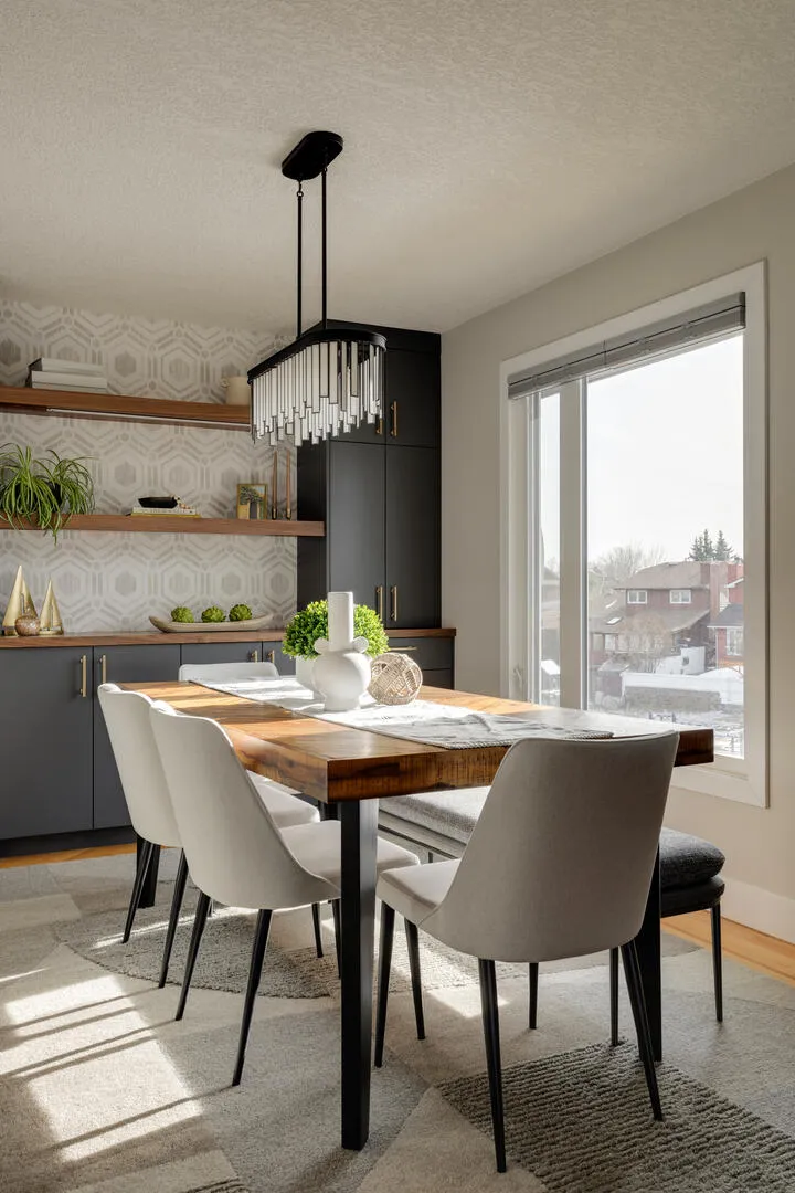 Light and bright dining room with blue grey built-ins and gold hardware, wood dining table with upholstered chairs and bench
