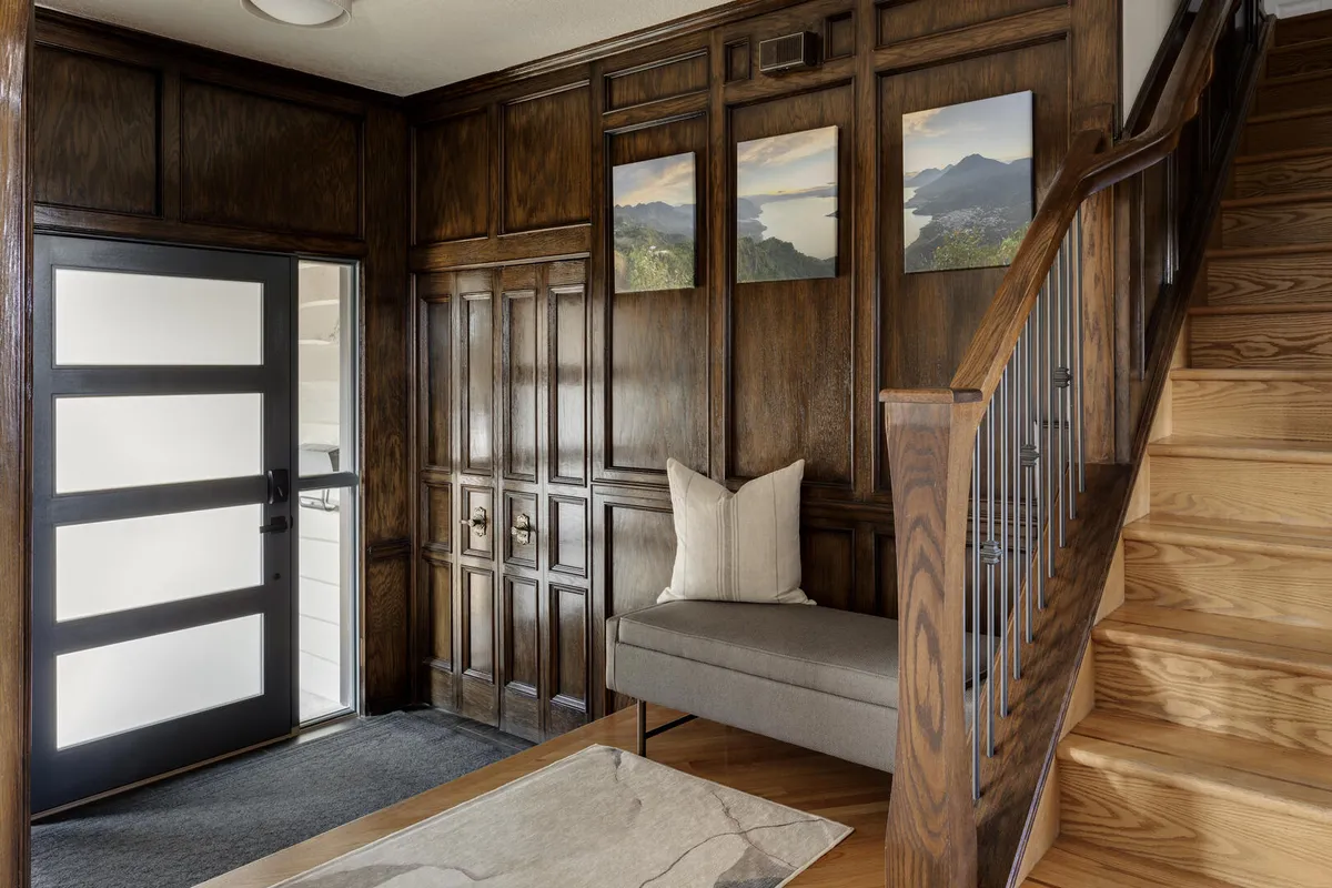 Dark wood entryway with modern accent pieces