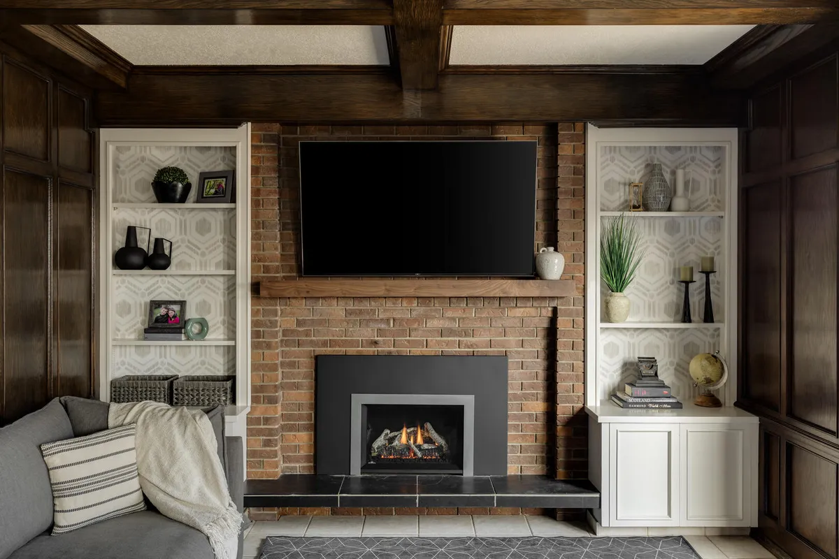 Dark wood and brick fireplace surround in modern blue and white living room