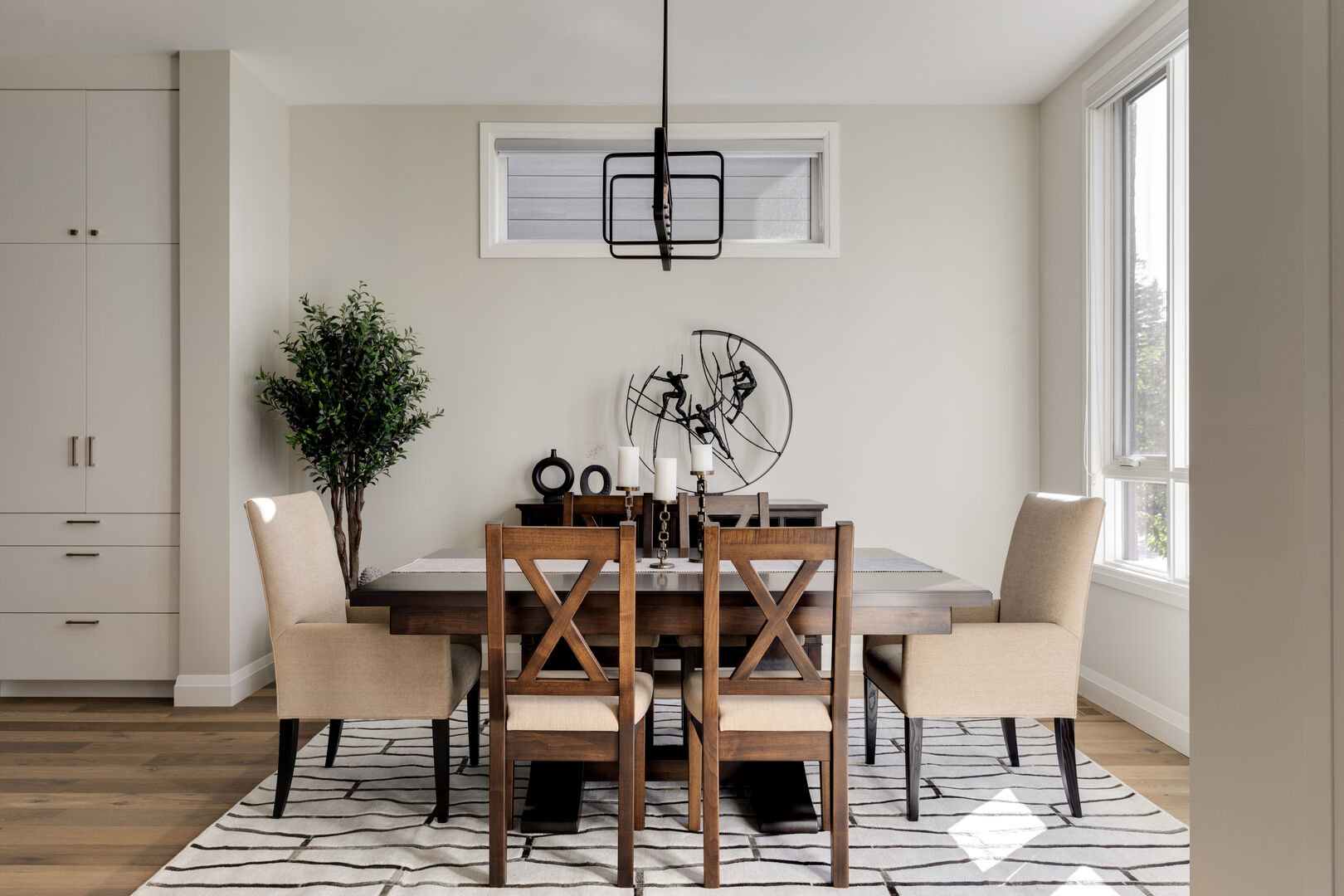 Modern black and white dining room with wood accent