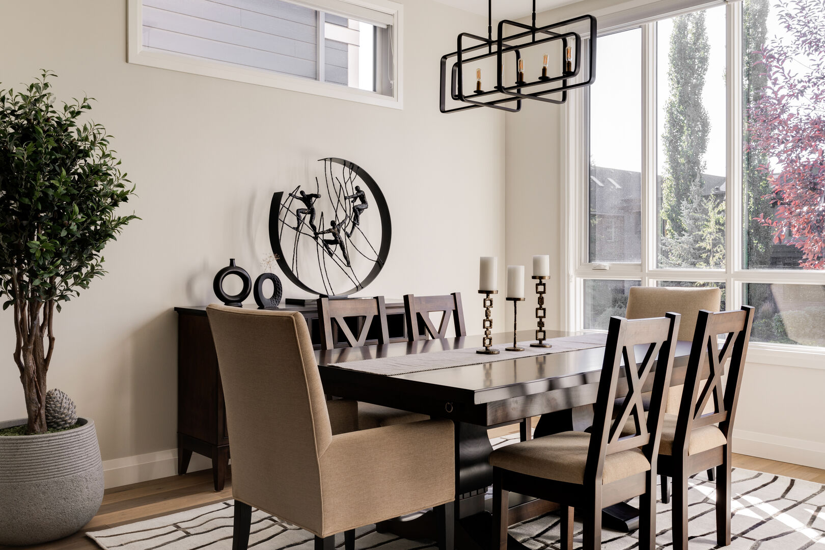 Modern black and white dining room with wood accent detail