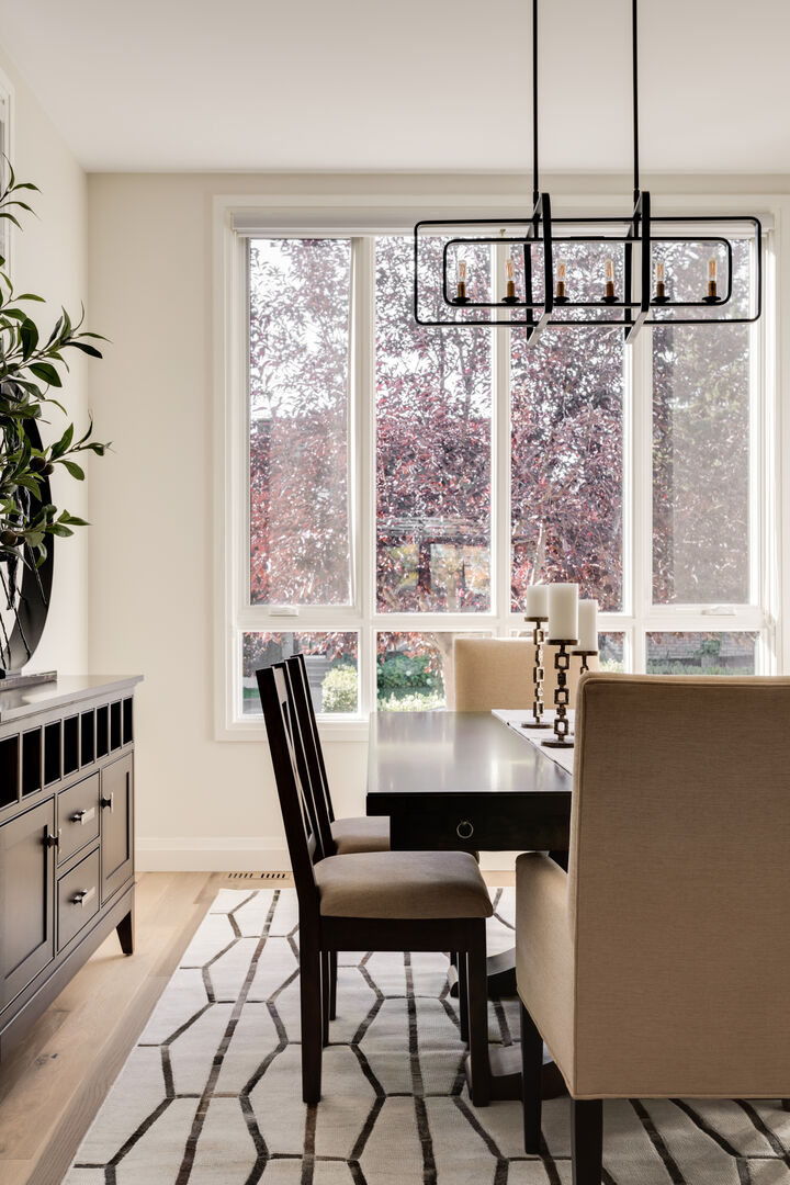 Modern black and white dining room with natural wood accent