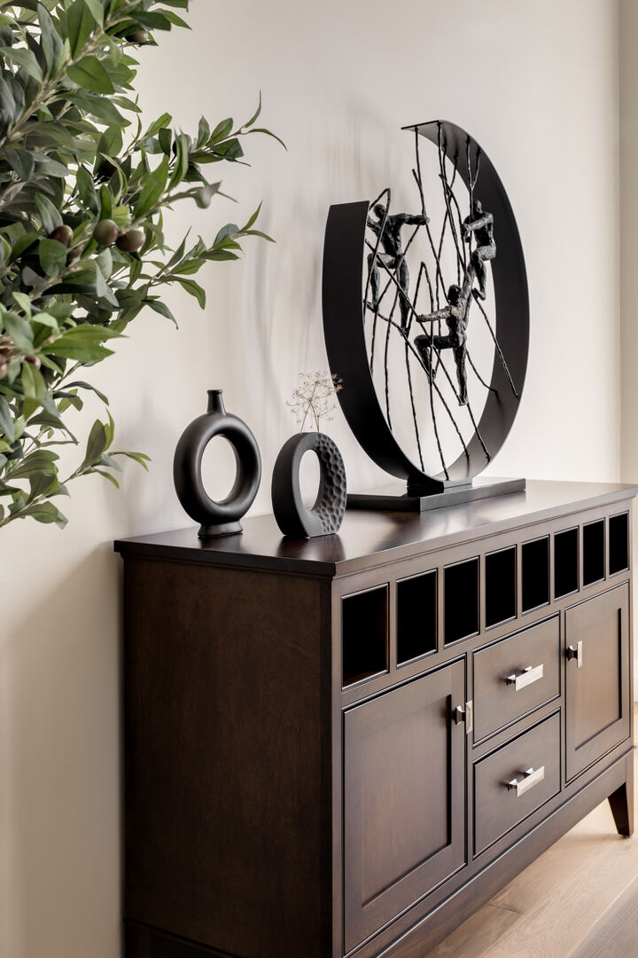 Natural wood sideboard with black decor