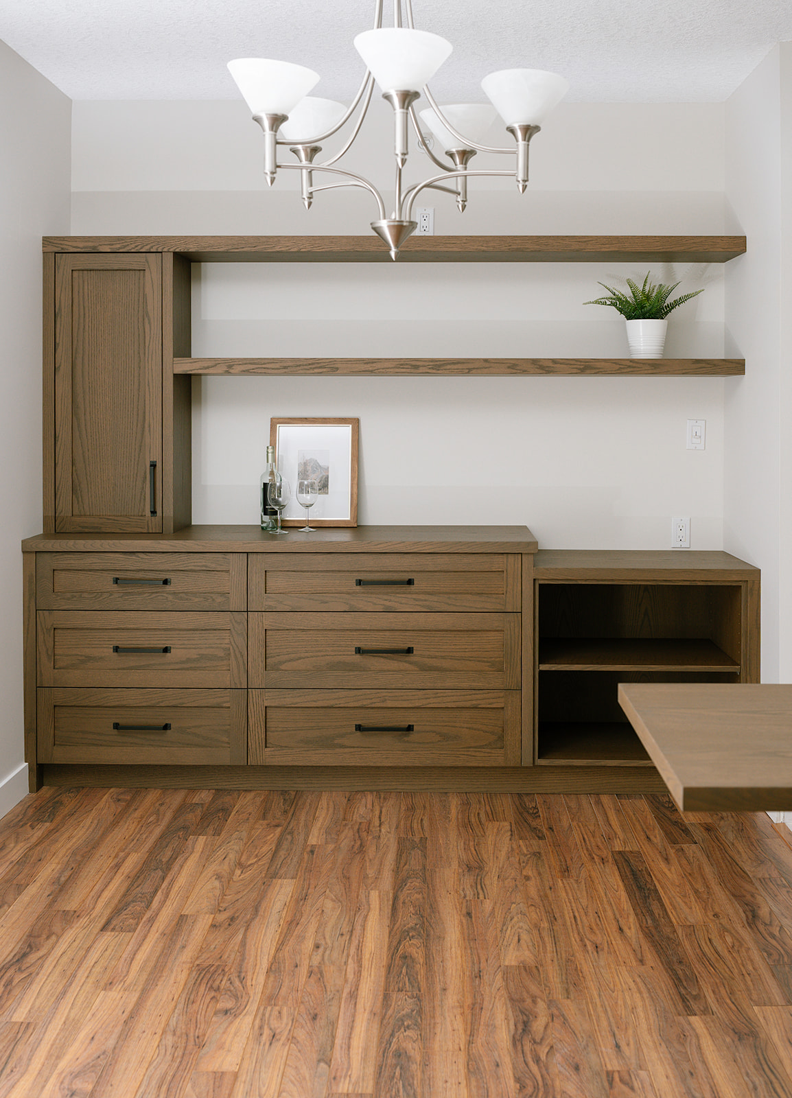 Walnut built-in cabinetry with black accents, modern industrial design