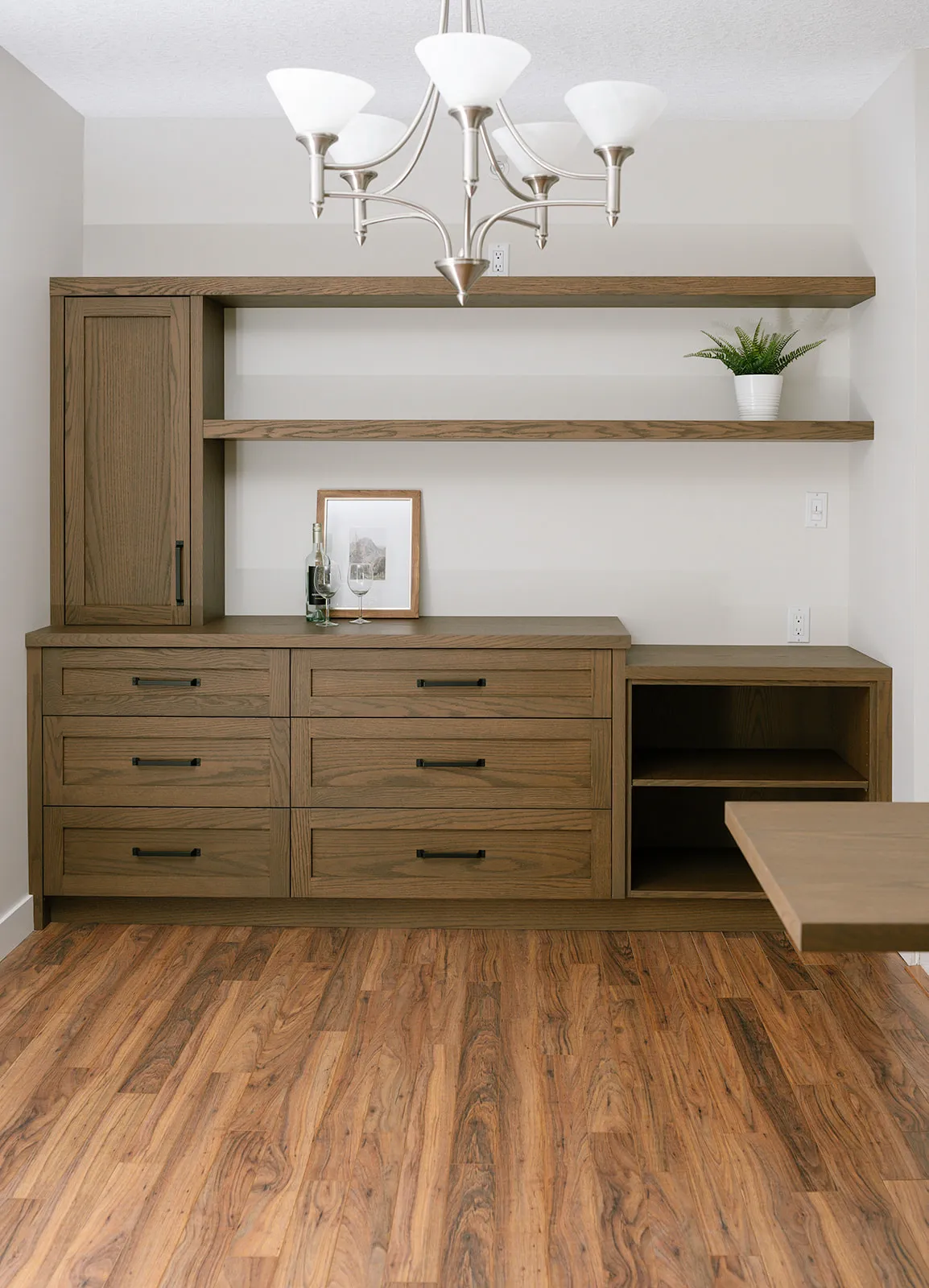Walnut built-in cabinetry with black accents, modern industrial design