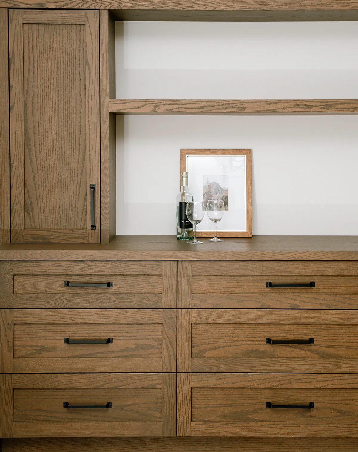 walnut built-in cabinetry with black accents, modern industrial design