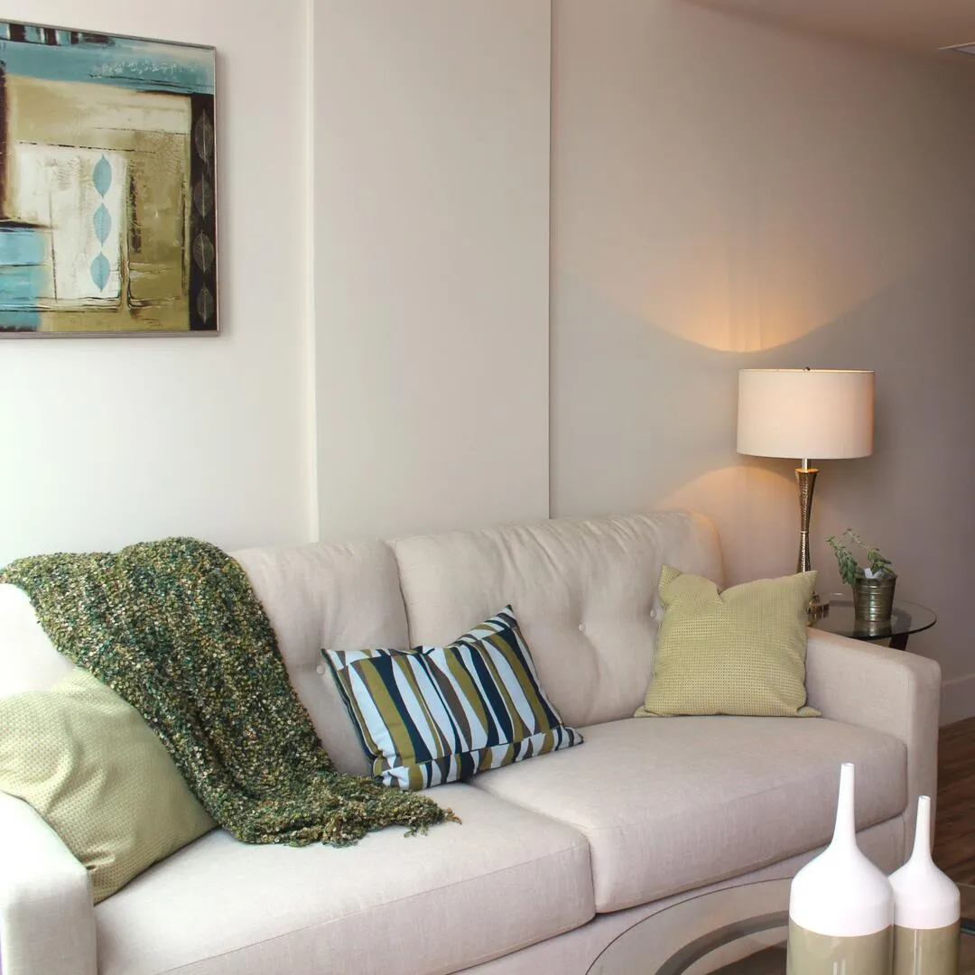 Cream, blue and green condo living room design