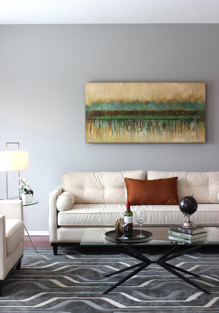 Cream, blue and green condo living room design