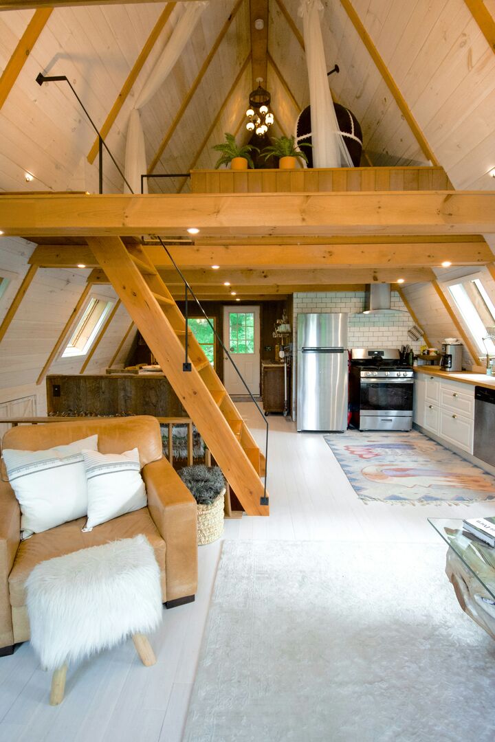 White and wood a-frame tiny home interior