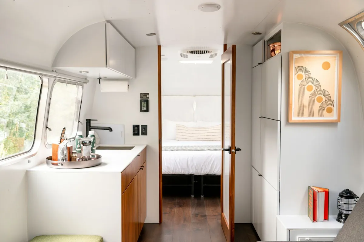 Mobile home with neutral two tone kitchen in white and wood