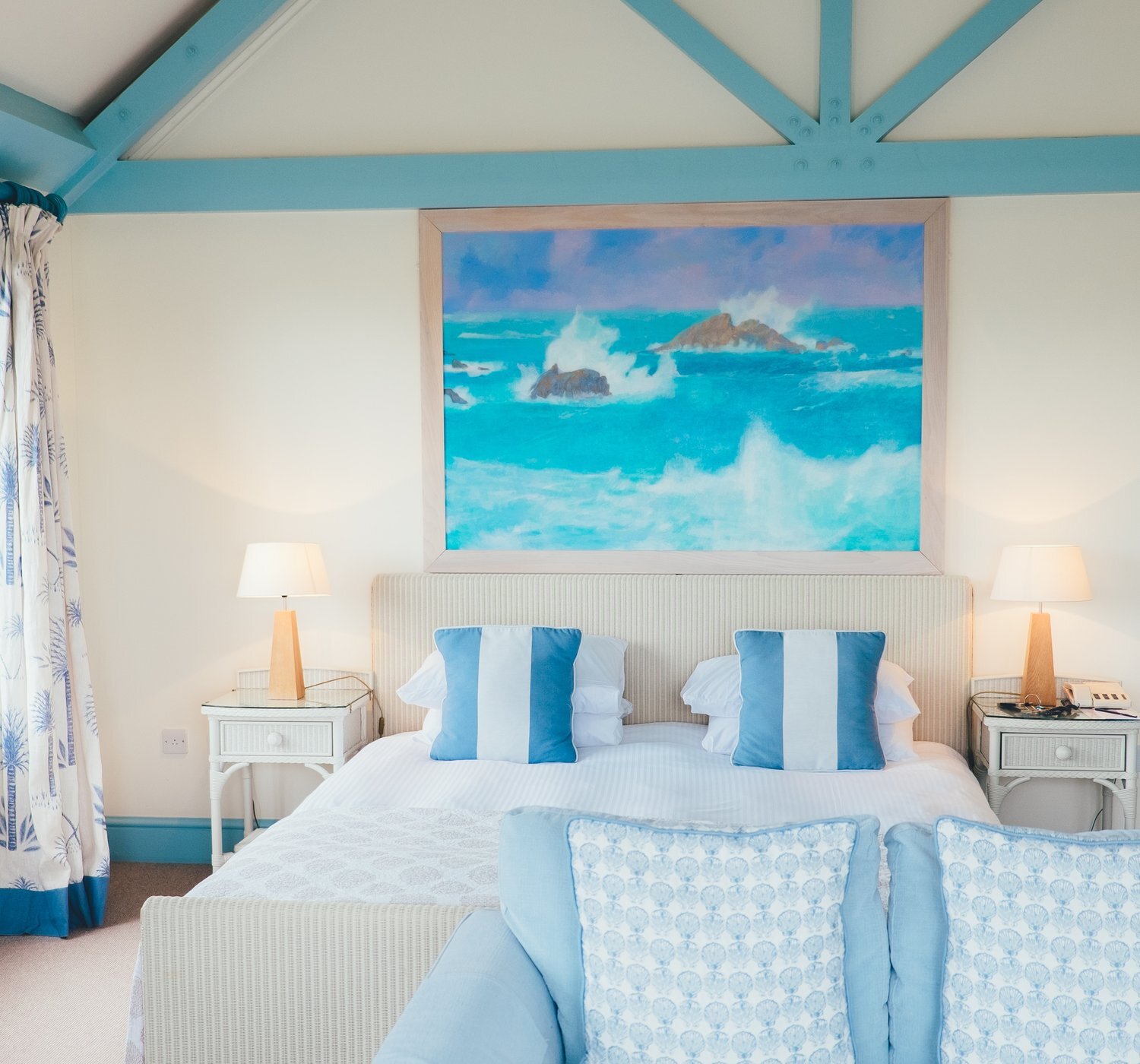 A beach-inspired bedroom, light bright airy, white and blue