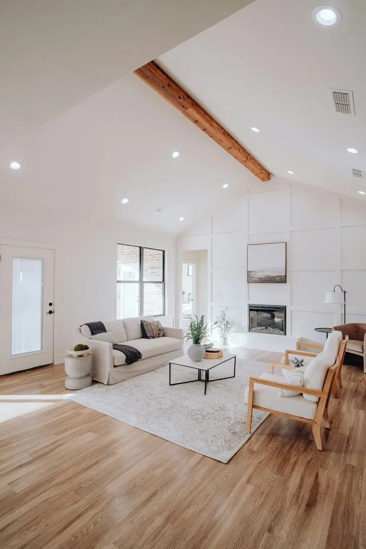 modern farmhouse living room with wainscotting feature wall and neutral furniture
