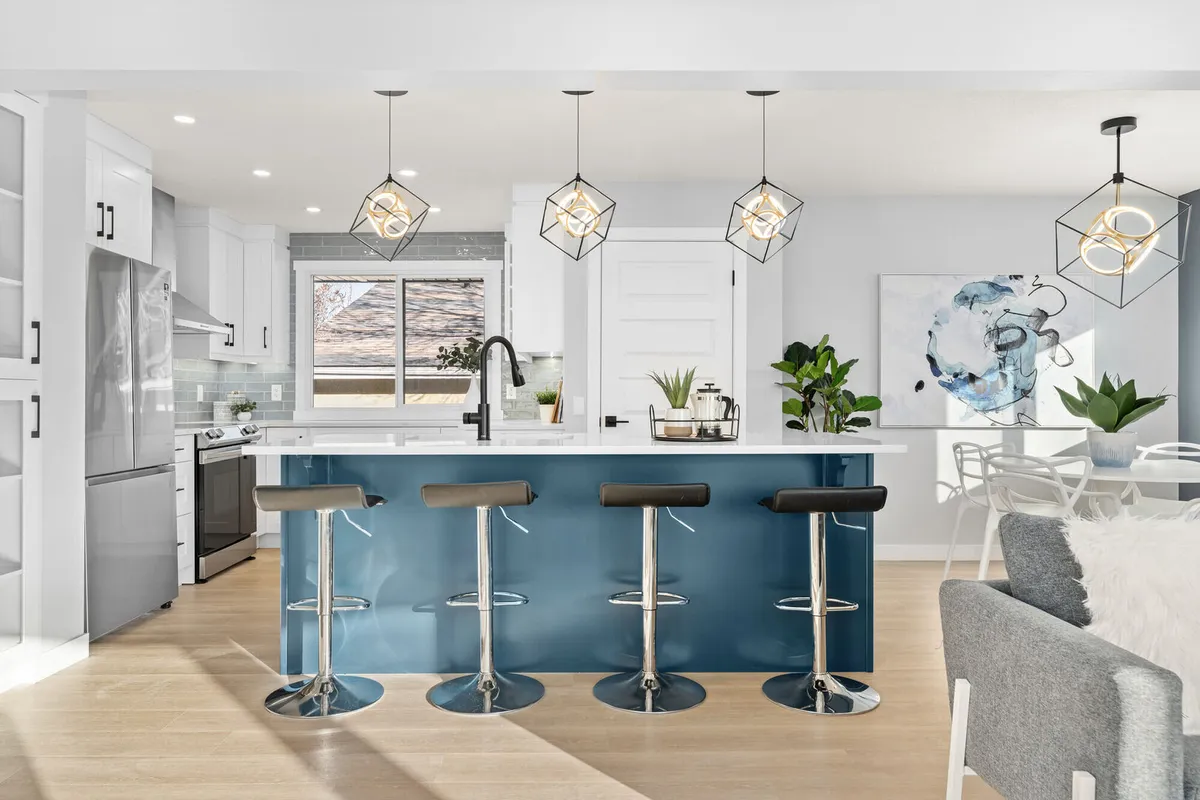Blue and white open concept kitchen, Calgary house flip design ideas