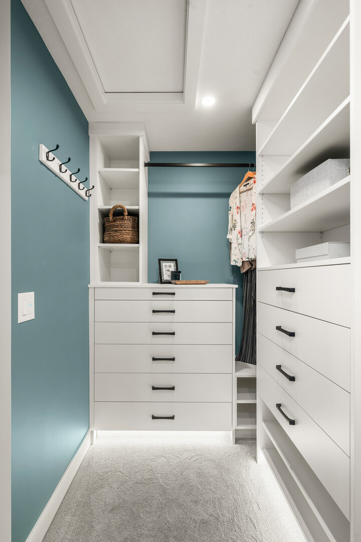 Guest bedroom with large open bookshelves