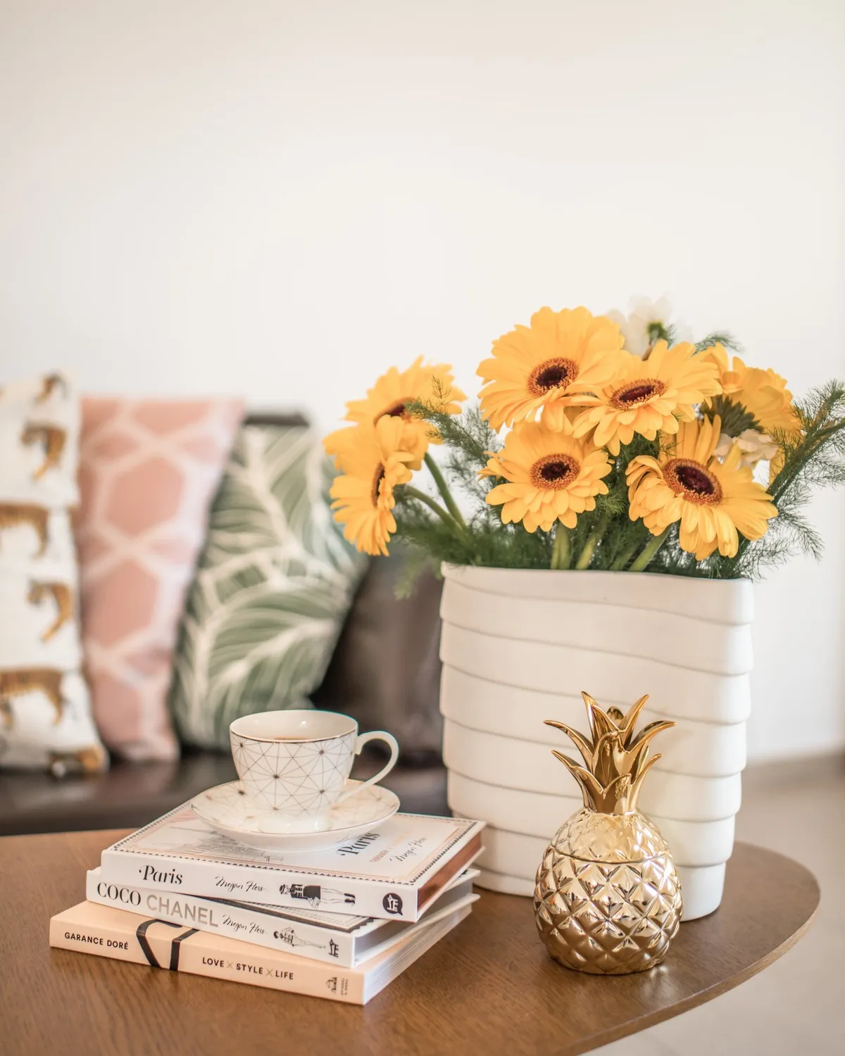 Yellow flowers in a white vase