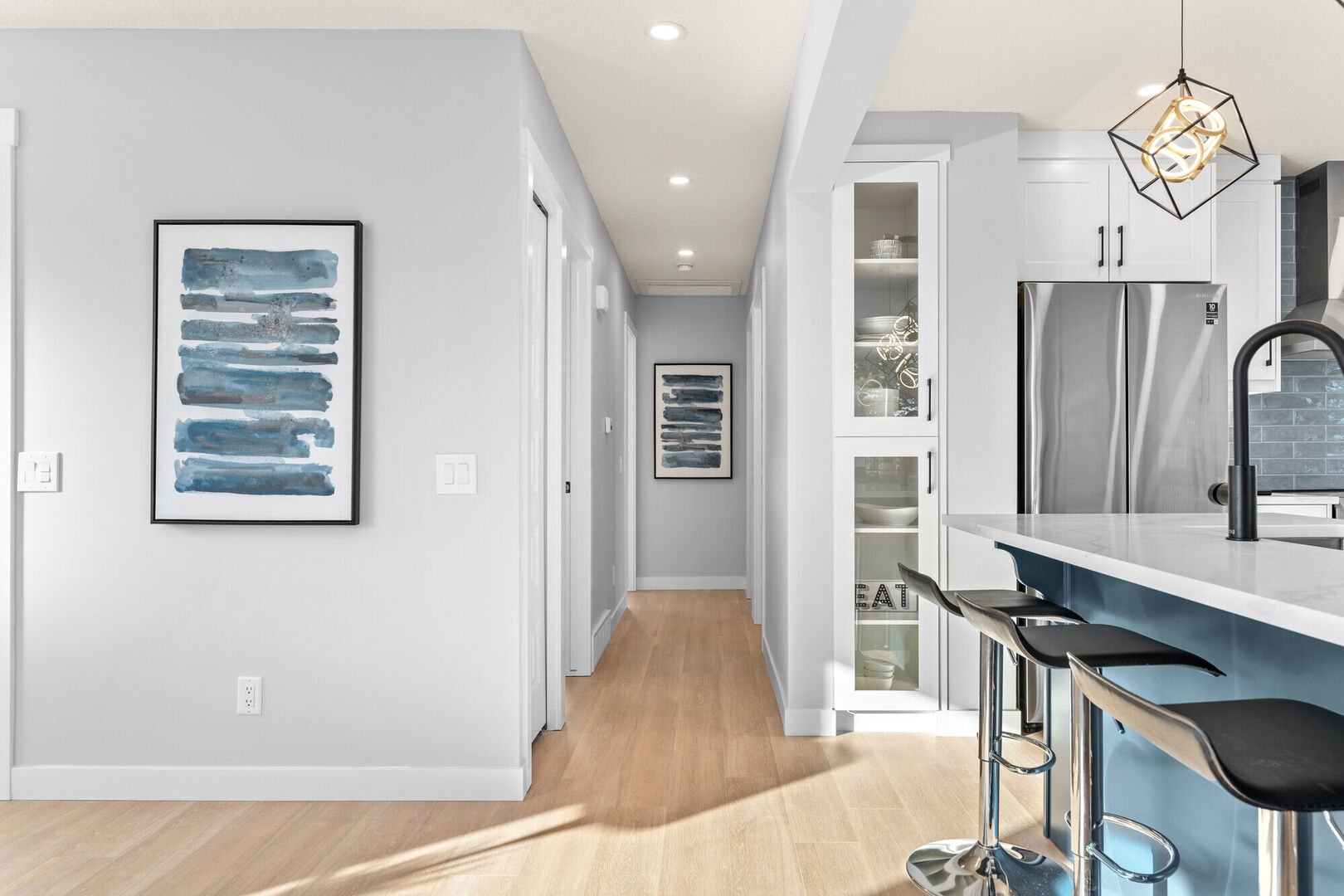 Blue and white open concept kitchen, Calgary house flip design ideas