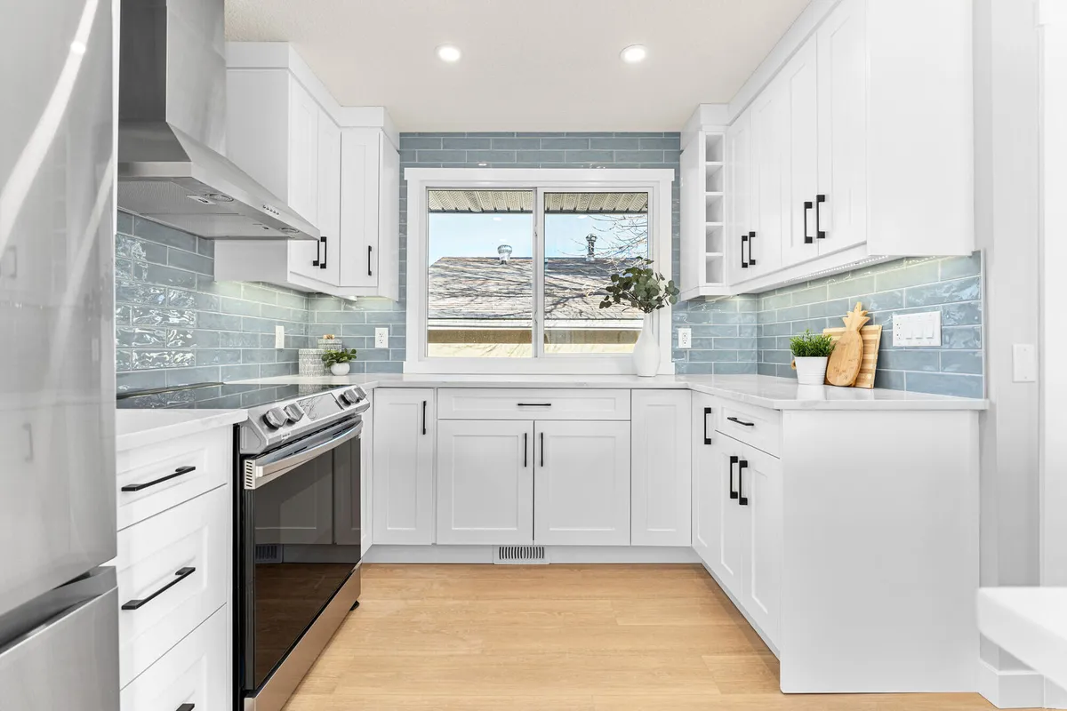 Cream and white bathroom concept with green backsplash