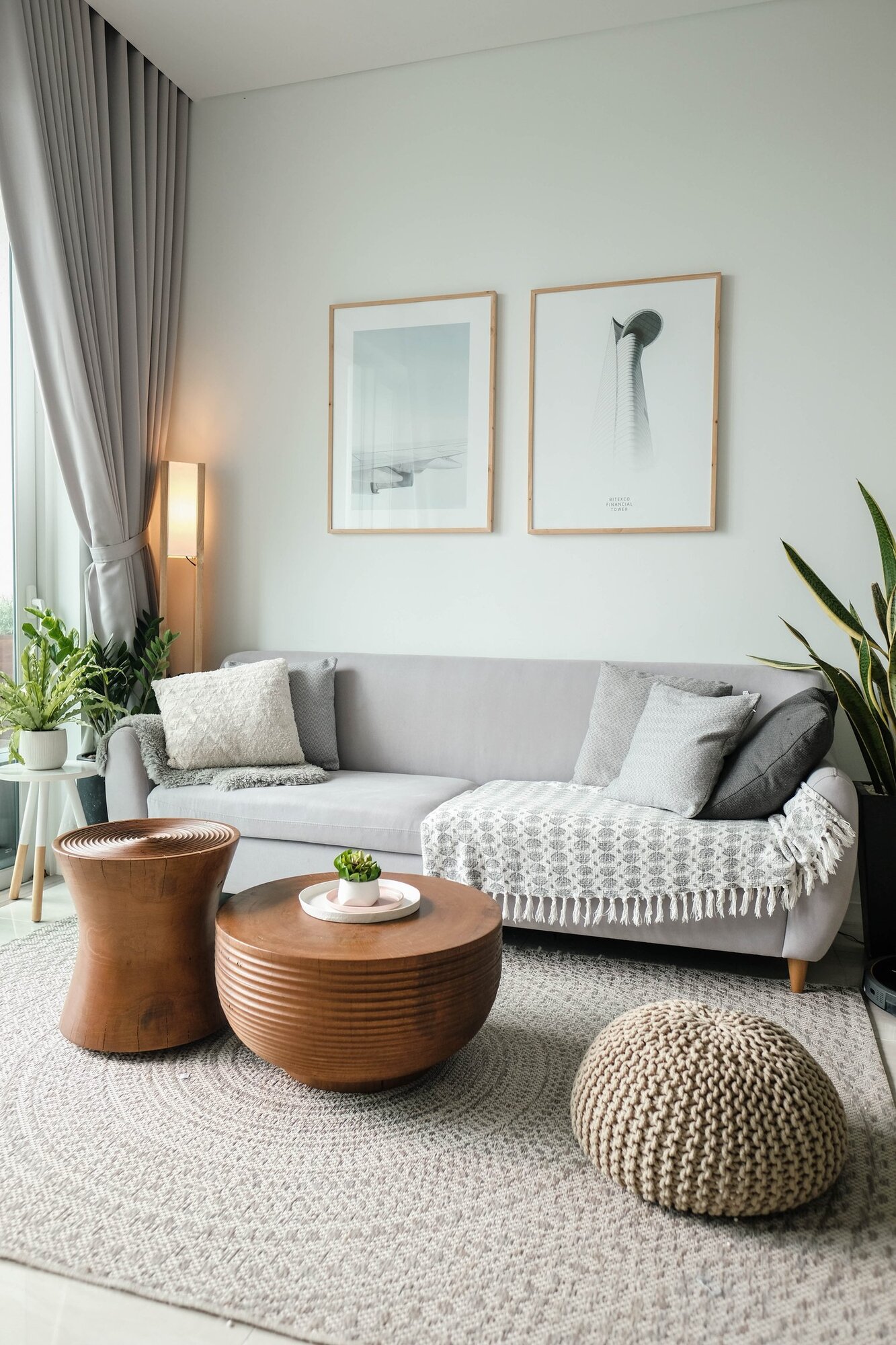 Grey and white living room with plants and copper accent