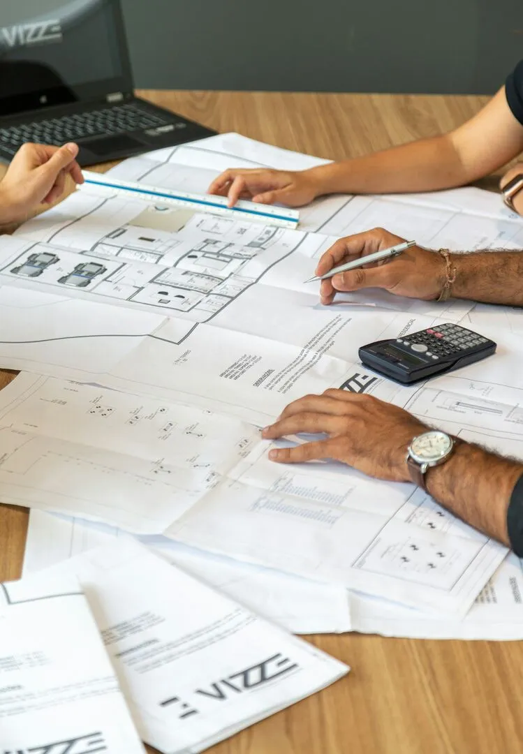 Planning a home renovation with blueprints and schedules
