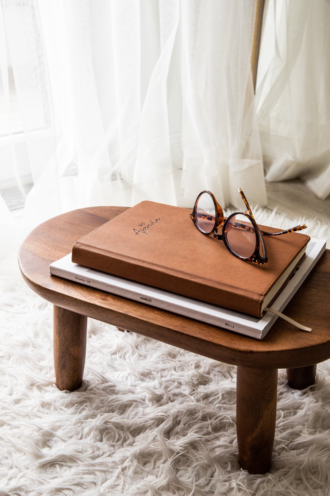 Rustic coffee table with book and glasses
