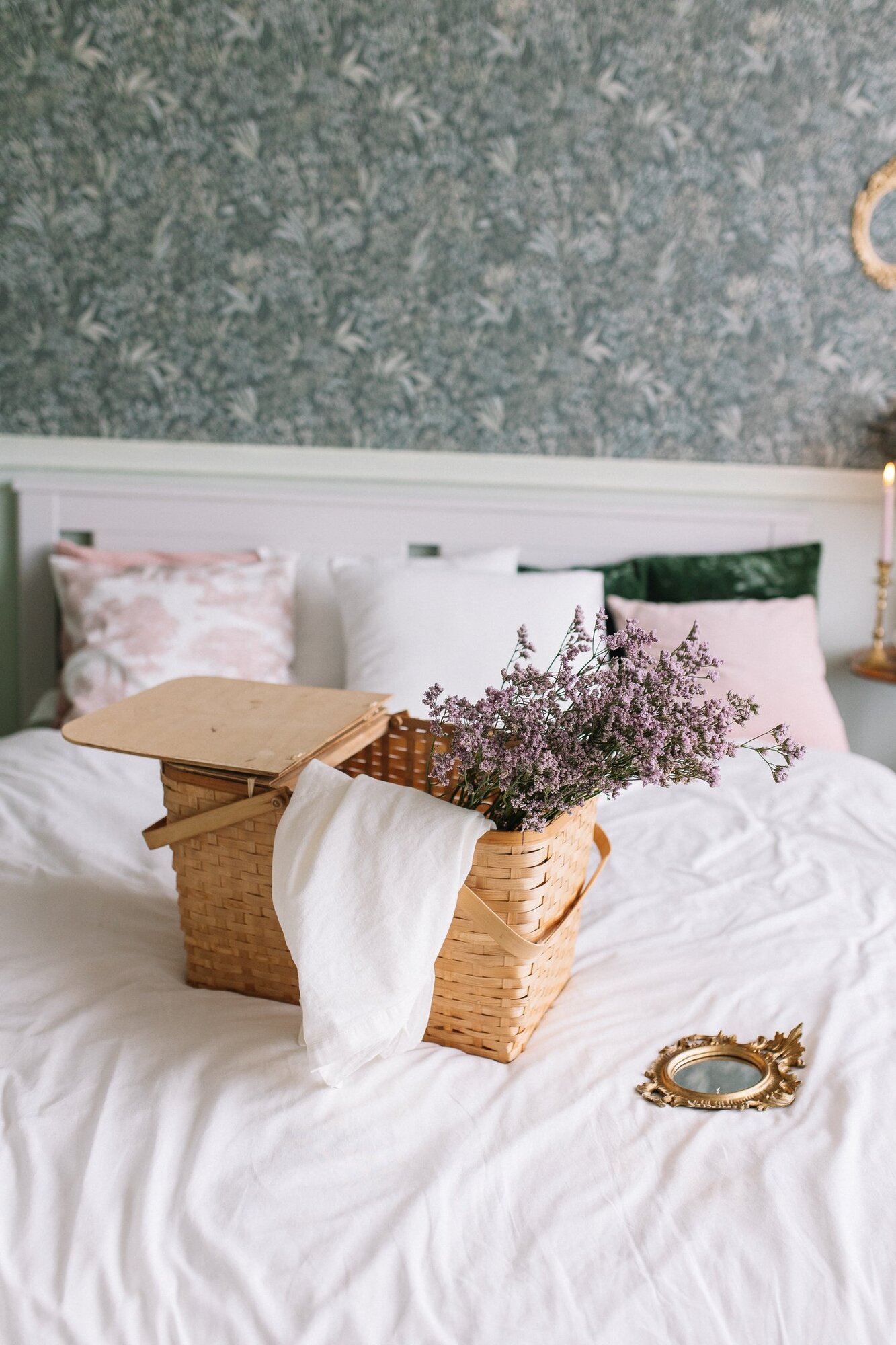 Wicker basket with lavender on a white modern bed
