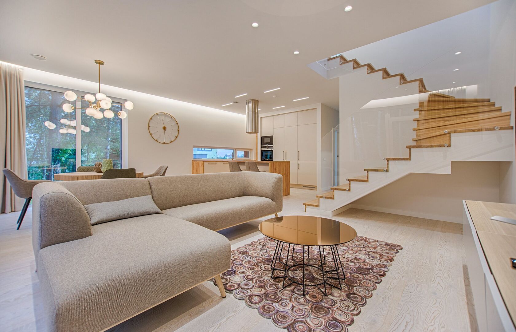 Modern living room with curved staircase