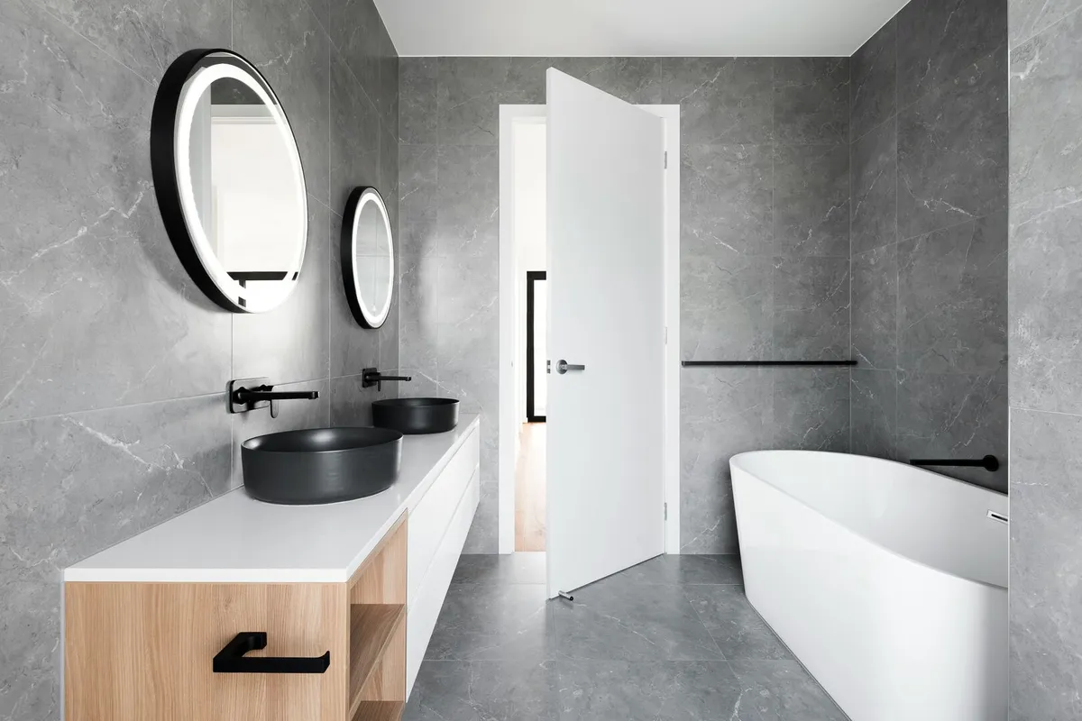 Neutral contemporary bathroom, masculine bathroom in grey black and white with wood accents.